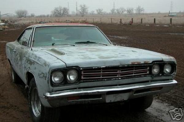 1968 Plymouth GTX Project car completely dissassembled on rolling wheels